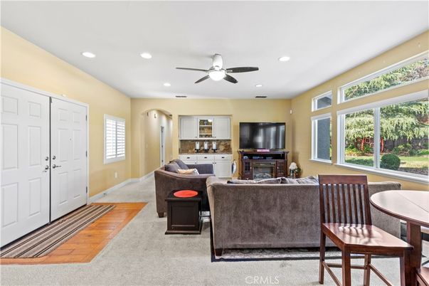 Dining room, Fireplace, Interior, Living room, Recessed Lighting, Wood Texture Flooring