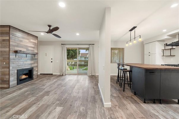 Fireplace, Interior, Kitchen, Pendant Lights, Recessed Lighting, Stone Walls, Wood Texture Flooring