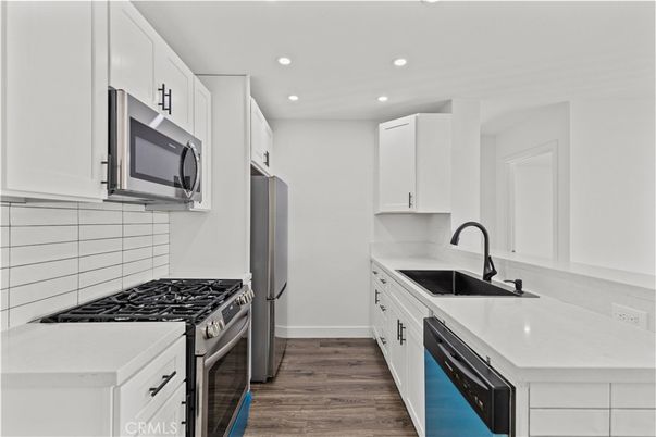 Interior, Kitchen, Recessed Lighting, Stainless Steel Appliances, Wood Texture Flooring