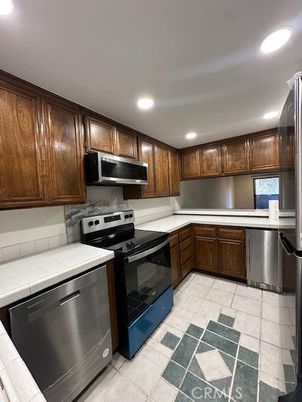 Interior, Kitchen, Recessed Lighting, Stainless Steel Appliances, Tile Countertops