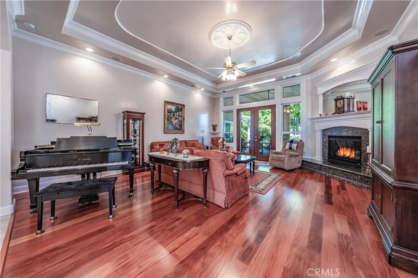 Fireplace, Interior, Living room, Piano, Recessed Lighting, Wood Texture Flooring