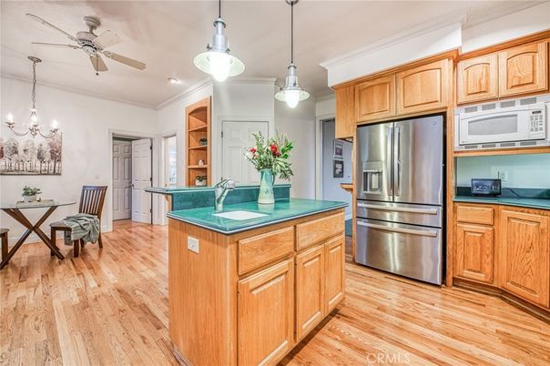 Chandelier, Dining room, Interior, Kitchen, Pendant Lights, Recessed Lighting, Stainless Steel Appliances, Wood Texture Flooring