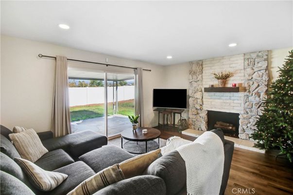 Fireplace, Interior, Living room, Recessed Lighting, Stone Walls, Wood Texture Flooring