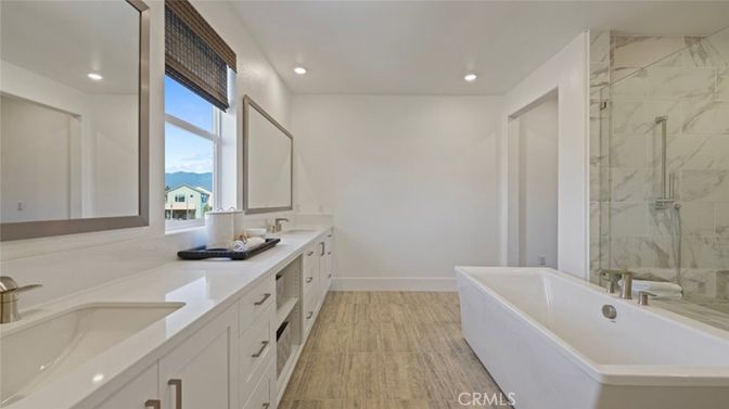 Bathroom, Dual Sink Vanities, Free Standing Baths, Interior, Marble Walls, Recessed Lighting, Wood Texture Flooring