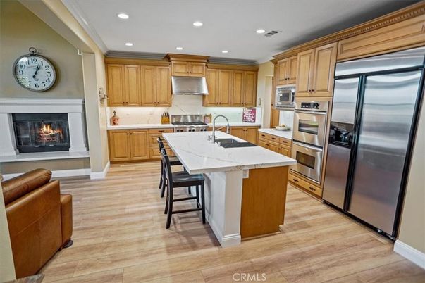 Fireplace, Interior, Kitchen, Recessed Lighting, Stainless Steel Appliances, Wood Texture Flooring