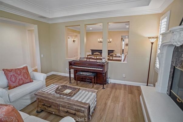Fireplace, Interior, Living room, Piano, Recessed Lighting, Wood Texture Flooring