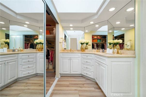 Bathroom, Dual Sink Vanities, Interior, Recessed Lighting, Walk-in Closets, Wood Texture Flooring