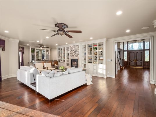 Dining room, Fireplace, Interior, Living room, Recessed Lighting, Wood Texture Flooring