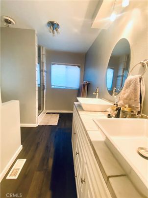 Bathroom, Dual Sink Vanities, Glass Shower, Interior, Tile Countertops, Wood Texture Flooring