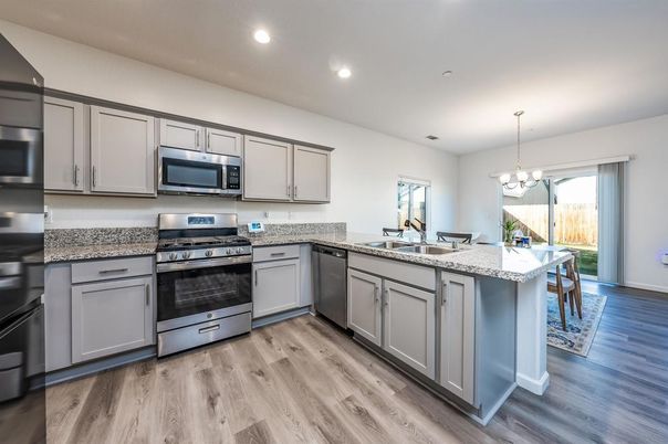 Chandelier, Interior, Kitchen, Recessed Lighting, Stainless Steel Appliances, Wood Texture Flooring