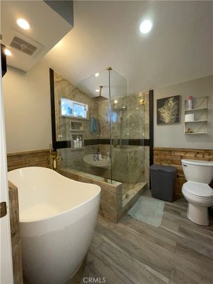 Bathroom, Free Standing Baths, Glass Shower, Interior, Recessed Lighting, Wood Texture Flooring