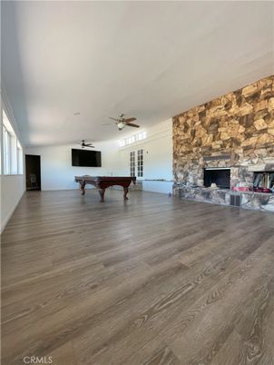 Billiard Table, Fireplace, Game Room, Interior, Stone Walls, Wood Texture Flooring