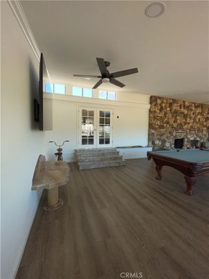 Billiard Table, Fireplace, Game Room, Interior, Recessed Lighting, Stone Walls, Wood Texture Flooring