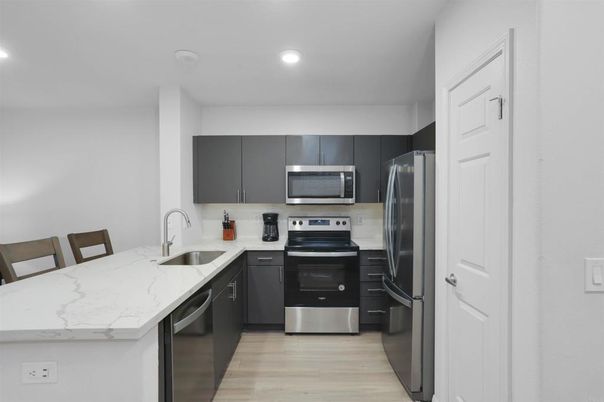 Interior, Kitchen, Recessed Lighting, Stainless Steel Appliances, Wood Texture Flooring