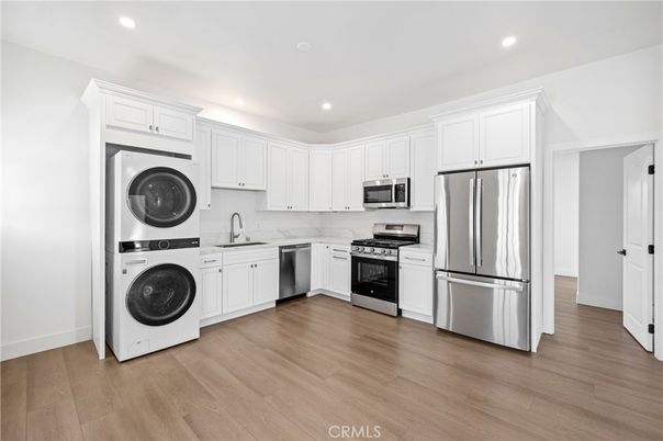 Interior, Kitchen, Recessed Lighting, Stainless Steel Appliances, Washer, Wood Texture Flooring