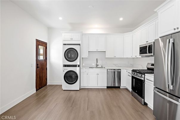 Interior, Kitchen, Recessed Lighting, Stainless Steel Appliances, Washer, Wood Texture Flooring