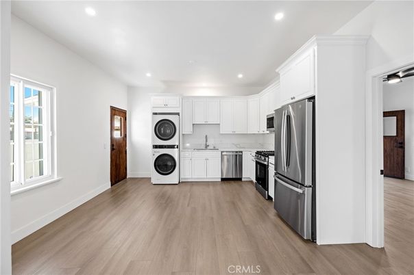 Interior, Kitchen, Recessed Lighting, Stainless Steel Appliances, Washer, Wood Texture Flooring