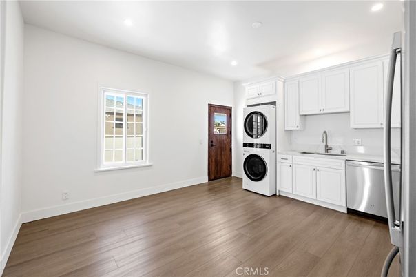 Interior, Kitchen, Recessed Lighting, Washer, Wood Texture Flooring