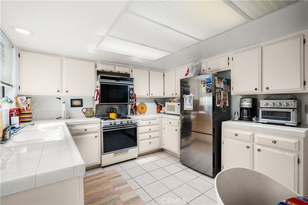 Interior, Kitchen, Recessed Lighting, Tile Countertops