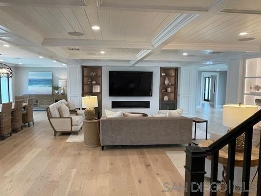 Chandelier, Dining room, Fireplace, Interior, Living room, Recessed Lighting, Water, Wood Texture Flooring