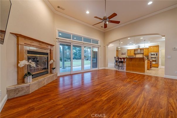 Empty room, Fireplace, Interior, Kitchen, Pendant Lights, Recessed Lighting, Stainless Steel Appliances, Wood Texture Flooring