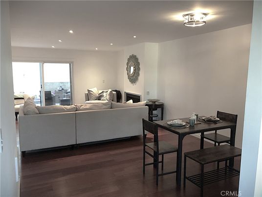 Dining room, Fireplace, Interior, Living room, Recessed Lighting, Wood Texture Flooring