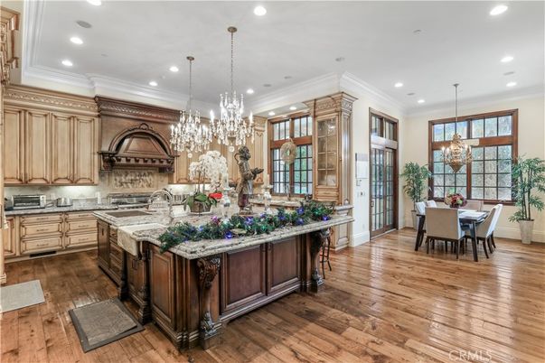 Chandelier, Dining room, Interior, Kitchen, Pendant Lights, Recessed Lighting, Stainless Steel Appliances, Wood Texture Flooring