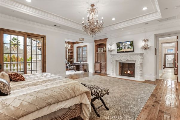 Bedroom, Chandelier, Fireplace, Interior, Recessed Lighting, Wood Texture Flooring