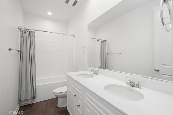Bathroom, Dual Sink Vanities, Interior, Recessed Lighting, Wood Texture Flooring