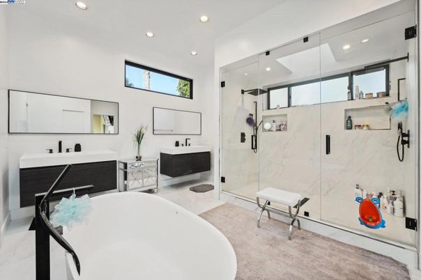 Bathroom, Dual Sink Vanities, Free Standing Baths, Glass Shower, Interior, Marble Walls, Recessed Lighting