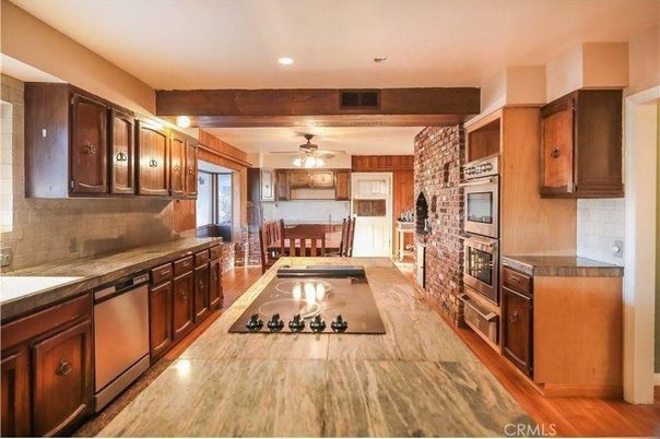 Dining room, Fireplace, Interior, Kitchen, Recessed Lighting, Stone Walls, Wood Texture Flooring