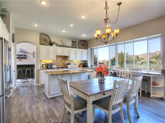 Chandelier, Dining room, Interior, Kitchen, Recessed Lighting, Stainless Steel Appliances, Wood Texture Flooring
