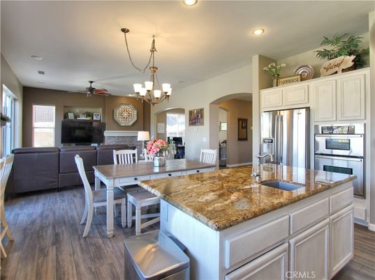 Chandelier, Dining room, Interior, Kitchen, Living room, Recessed Lighting, Stainless Steel Appliances, Wood Texture Flooring