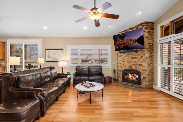 Fireplace, Interior, Living room, Recessed Lighting, Stone Walls, Wood Texture Flooring