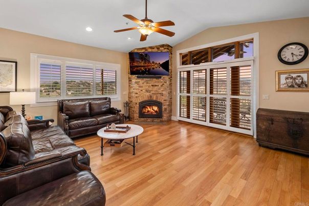 Fireplace, Interior, Living room, Recessed Lighting, Stone Walls, Wood Texture Flooring