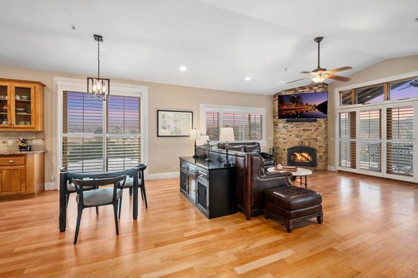 Dining room, Fireplace, Interior, Pendant Lights, Recessed Lighting, Stone Walls, Wood Texture Flooring