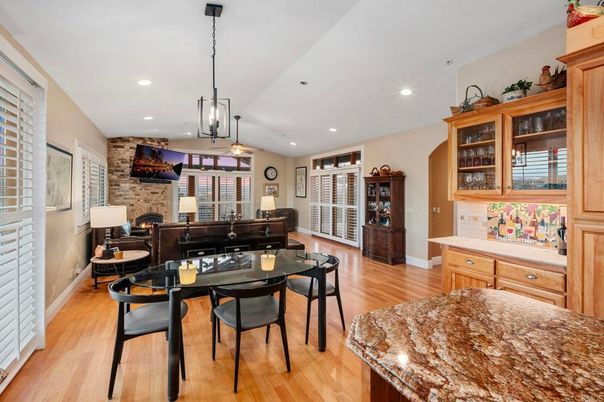 Dining room, Fireplace, Interior, Living room, Pendant Lights, Recessed Lighting, Stone Walls, Wood Texture Flooring
