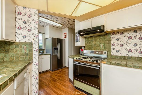 Interior, Kitchen, Stainless Steel Appliances, Tile Countertops, Wood Texture Flooring