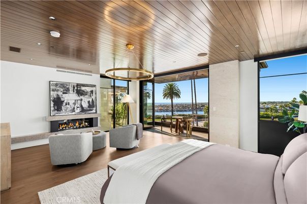 Bedroom, Fireplace, Interior, Pendant Lights, Recessed Lighting, Water, Wooden Ceilings, Wood Texture Flooring