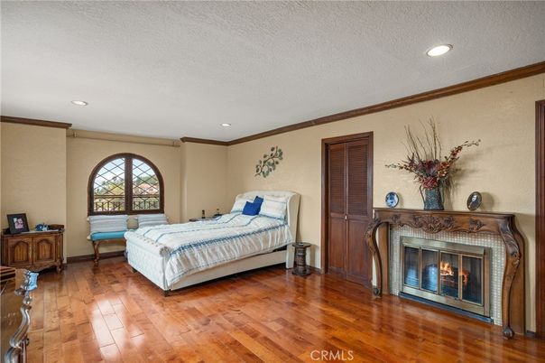 Bedroom, Fireplace, Interior, Recessed Lighting, Wood Texture Flooring