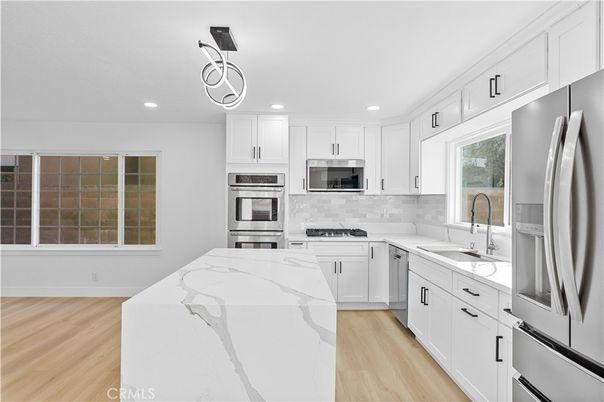 Interior, Kitchen, Pendant Lights, Recessed Lighting, Stainless Steel Appliances, Wood Texture Flooring