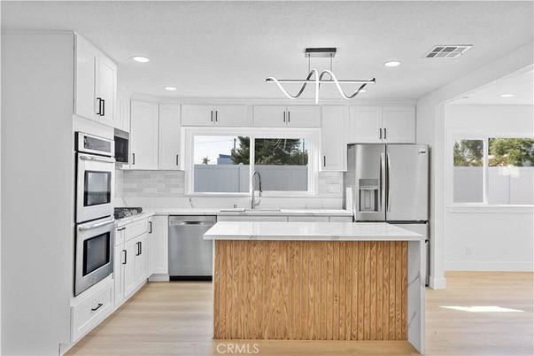 Interior, Kitchen, Pendant Lights, Recessed Lighting, Stainless Steel Appliances, Wood Texture Flooring