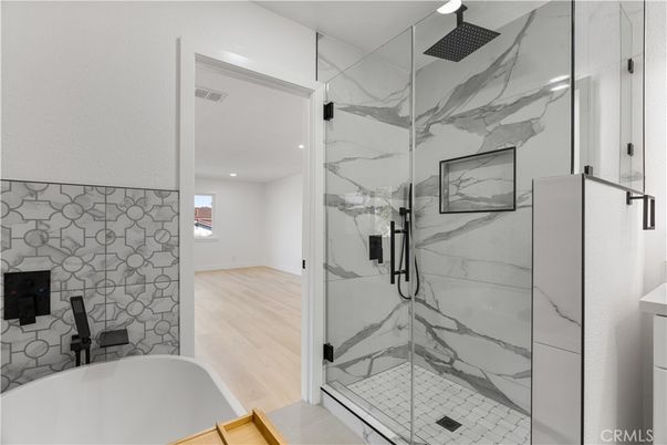 Bathroom, Glass Shower, Interior, Marble Walls, Recessed Lighting, Wood Texture Flooring