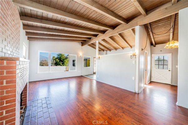Empty room, Fireplace, Interior, Pendant Lights, Stone Walls, Wooden Beams, Wooden Ceilings, Wood Texture Flooring
