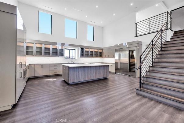 Interior, Kitchen, Marble Walls, Recessed Lighting, Stainless Steel Appliances, Wood Texture Flooring