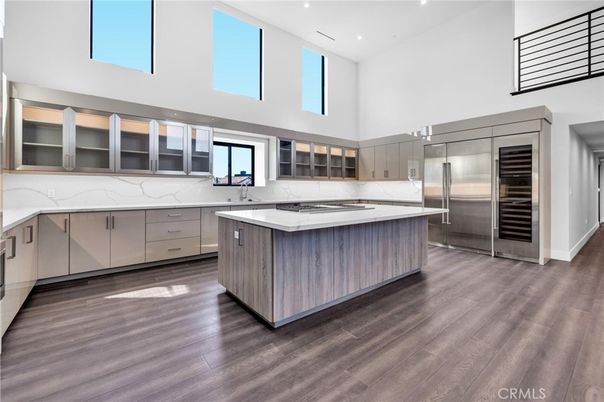 Interior, Kitchen, Marble Walls, Recessed Lighting, Stainless Steel Appliances, Wood Texture Flooring