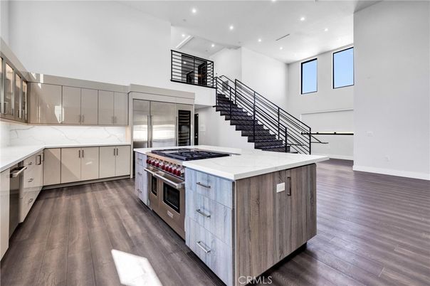 Interior, Kitchen, Marble Walls, Recessed Lighting, Stainless Steel Appliances, Wood Texture Flooring