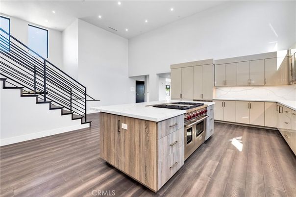 Interior, Kitchen, Marble Walls, Recessed Lighting, Stainless Steel Appliances, Wood Texture Flooring