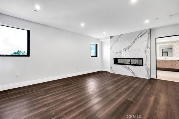 Empty room, Fireplace, Interior, Marble Walls, Recessed Lighting, Wood Texture Flooring