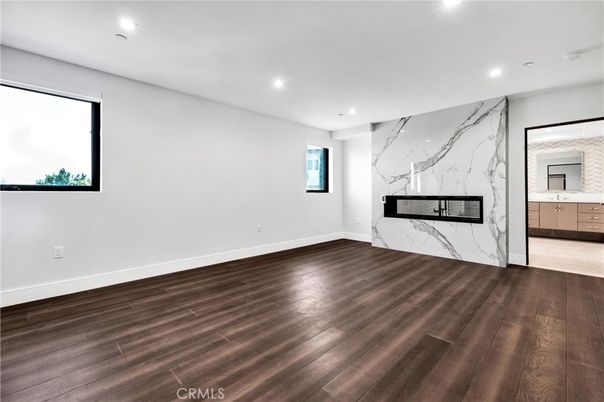 Empty room, Fireplace, Interior, Marble Walls, Recessed Lighting, Wood Texture Flooring